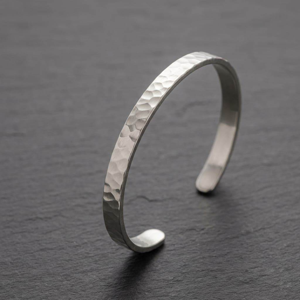 Ona hammered silver cuff, standing on dark slate